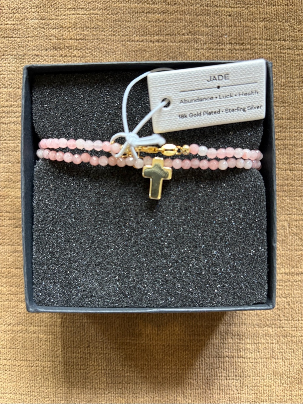 Pink jade beaded necklace with gold cross pendant